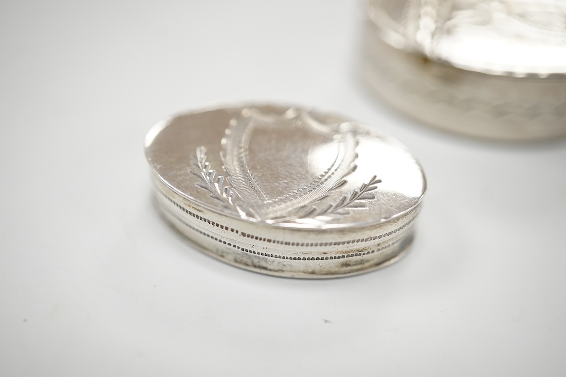 Two George III engraved silver oval patch boxes, largest with hinged cover, Samuel Pemberton, Birmingham, 1818, 28mm, the smaller by John Thornton, Birmingham, 1800.
